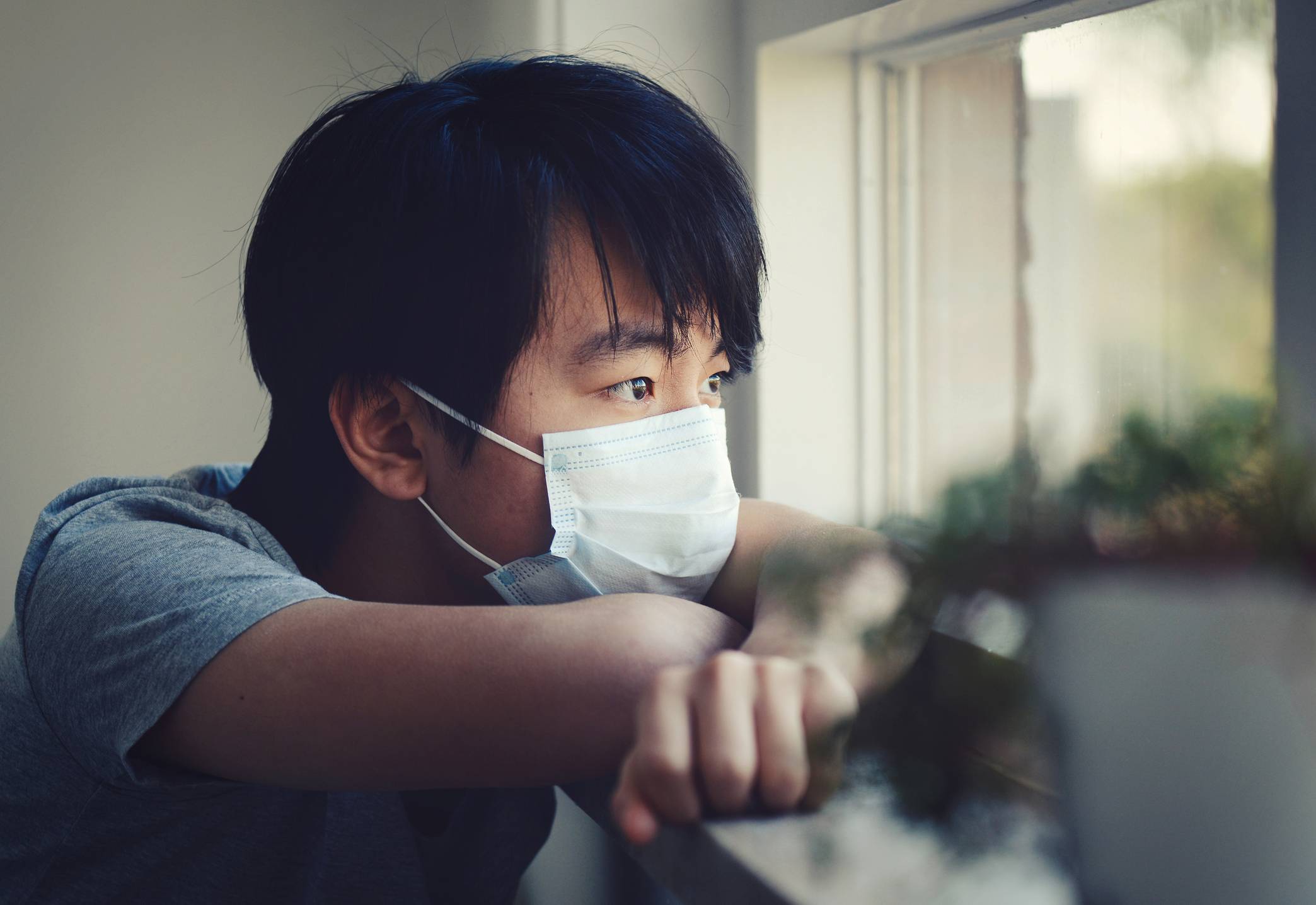 Young Asian boy in home quarantine